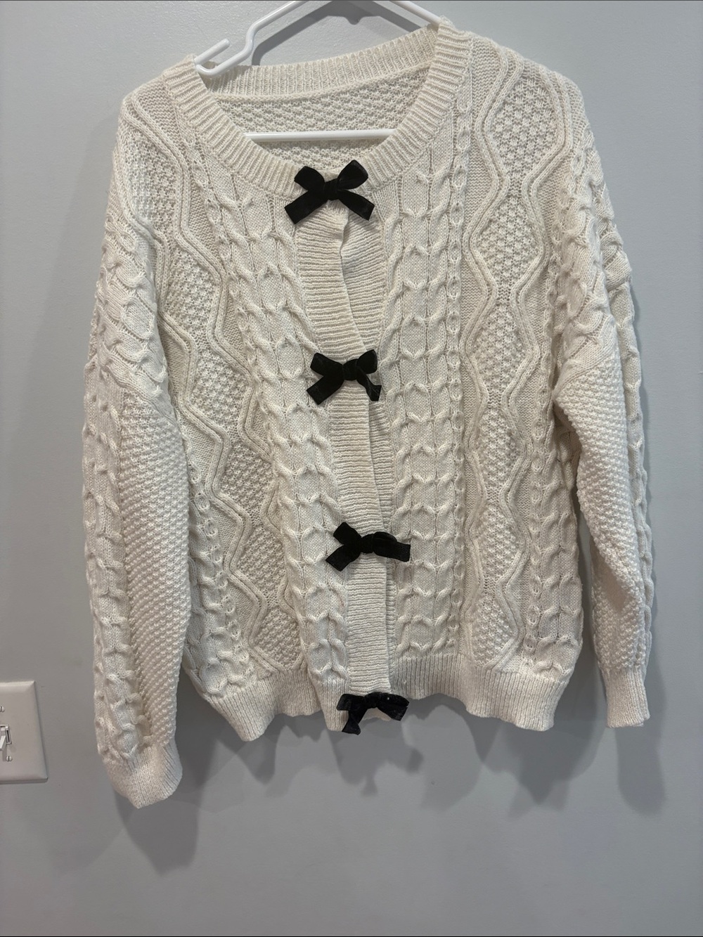 SHEIN Cream Cable Knit Cardigan with Black Bow Details ptp 22 length 25